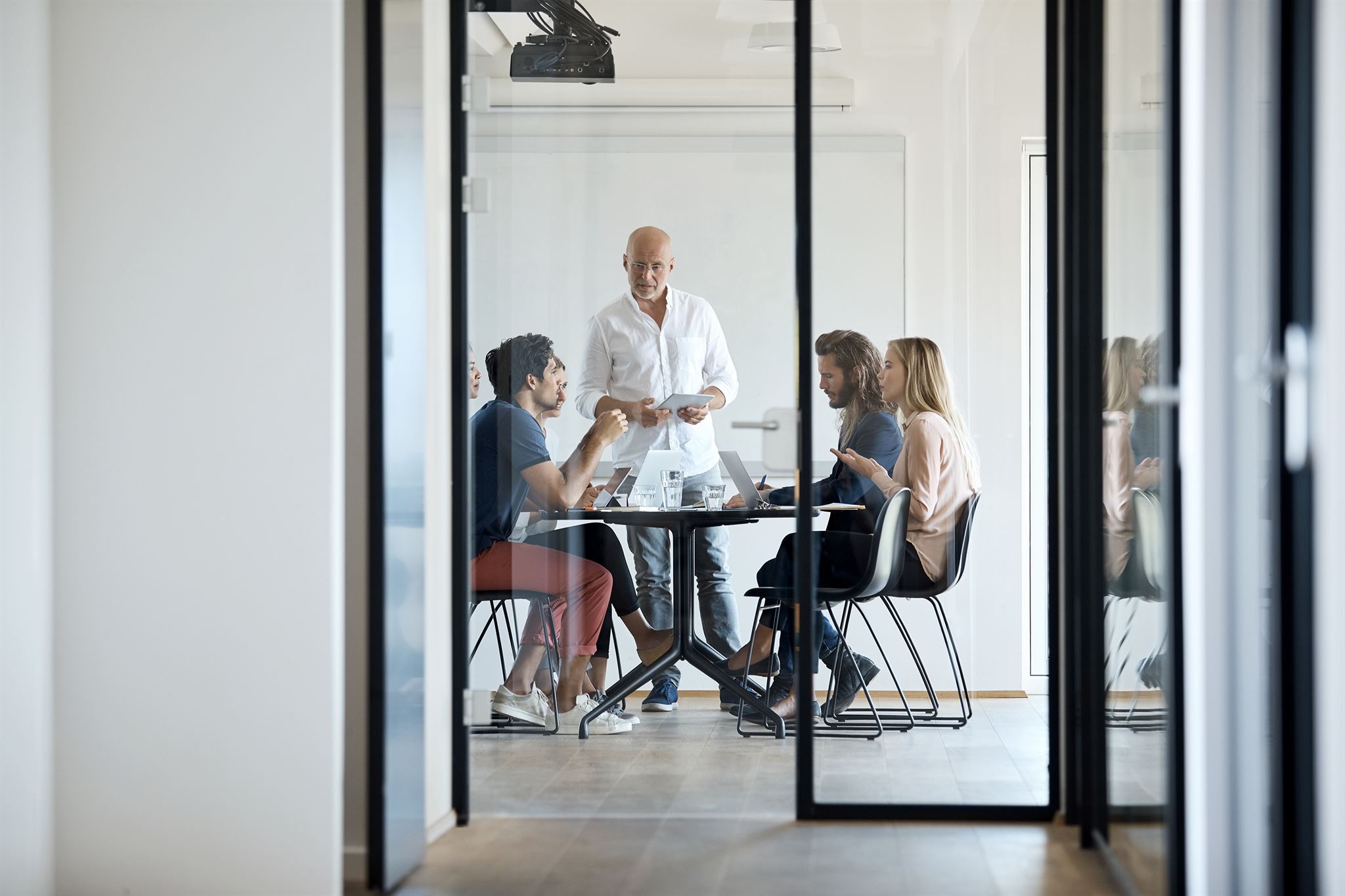 Team collaborating in bright meeting room